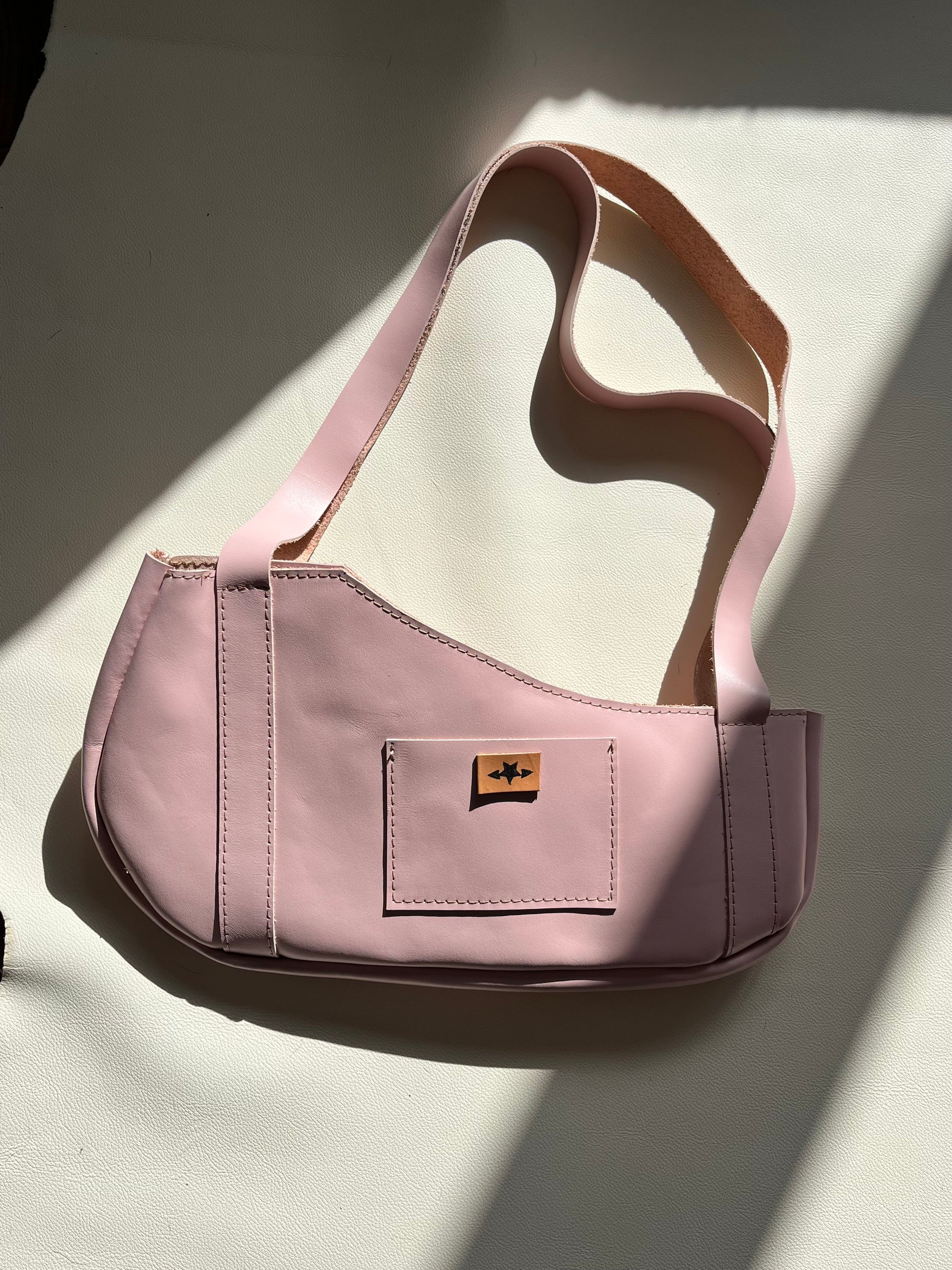 Pink pierced pair shoulder bag