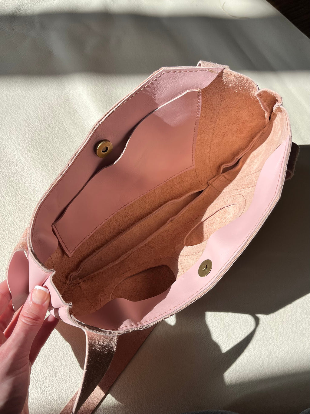 Pink pierced pair shoulder bag