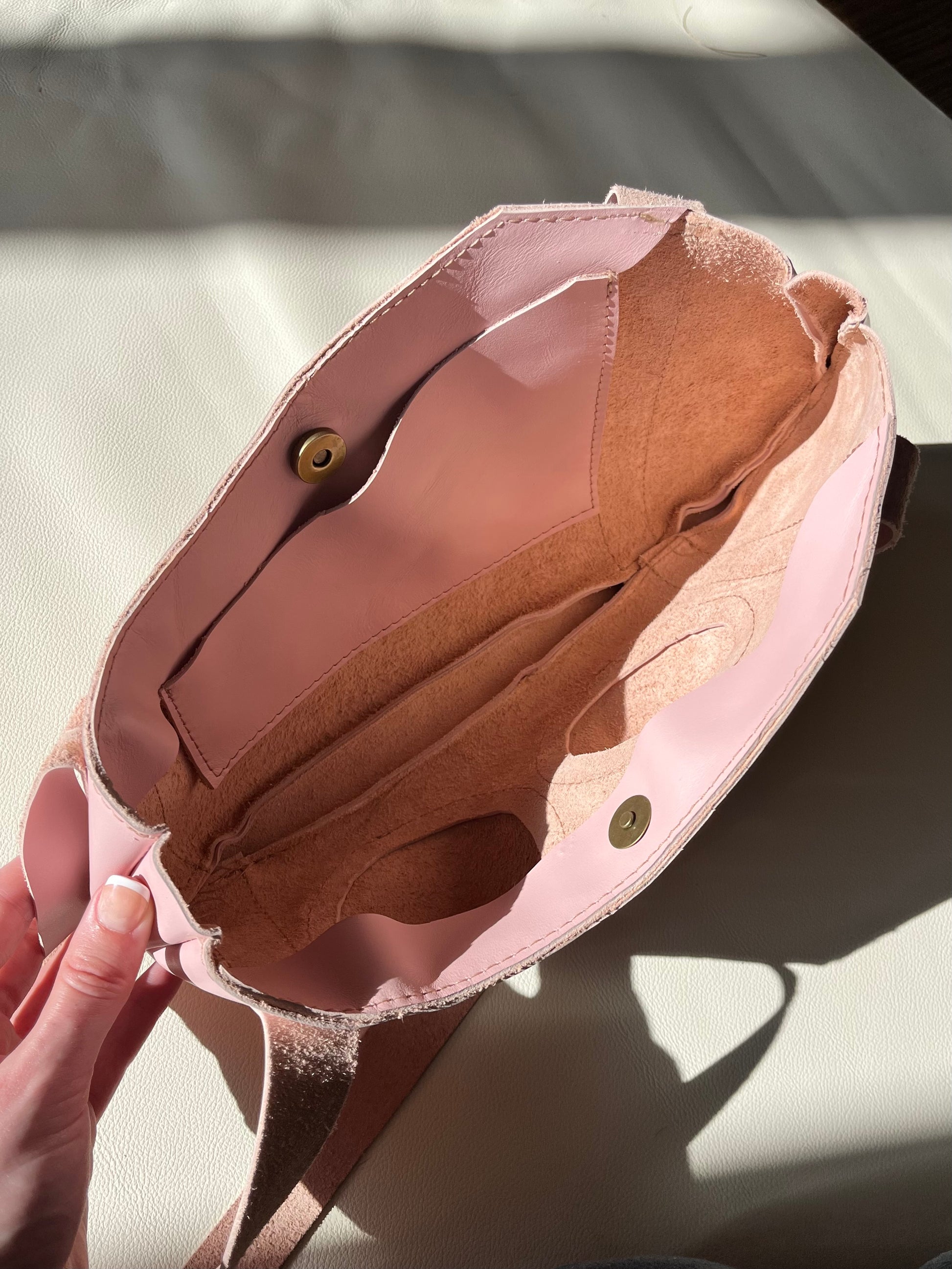 Pink pierced pair shoulder bag